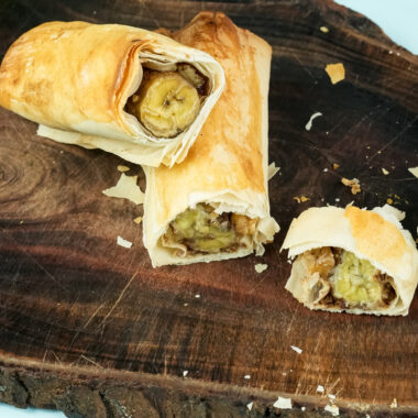 Close-up of banana strudel slice with walnut filling