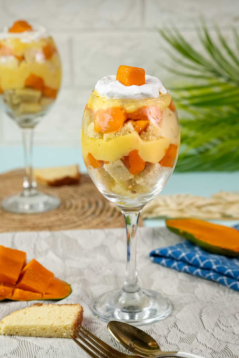 Finished mango trifle ready to serve with tropical garnish