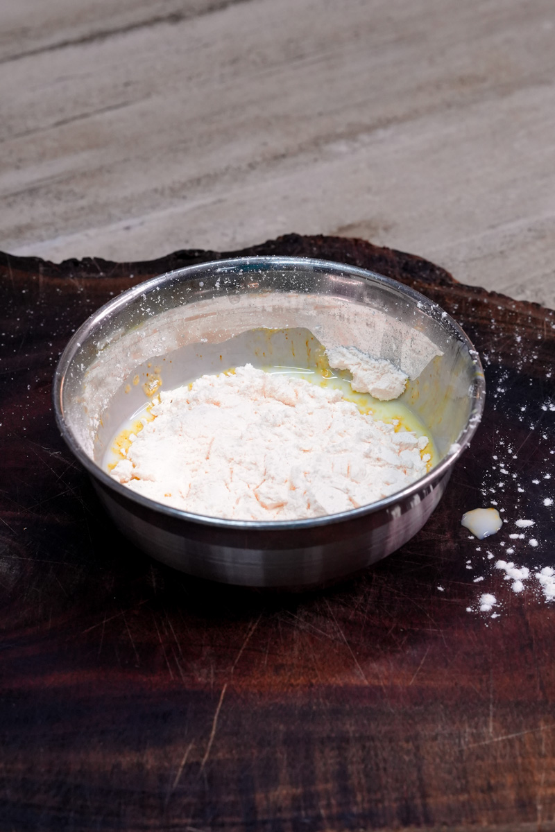 Flour mixture in bowl for trifle custard preparation