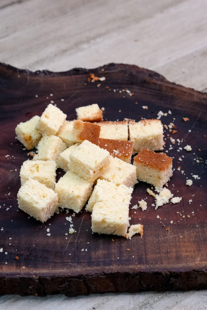 Fresh cut cake cubes ready for mango trifle layering