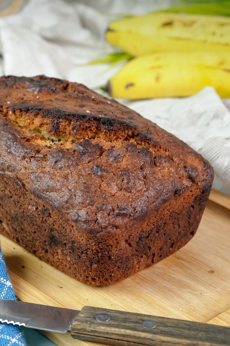 A whole loaf of moist Hawaiian banana bread cooling after baking.