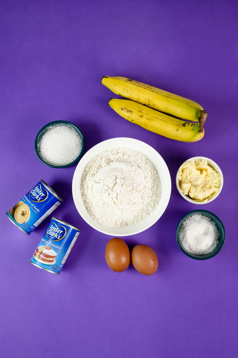 Ingredients for Hawaiian banana bread including bananas, flour, sugar, and eggs.