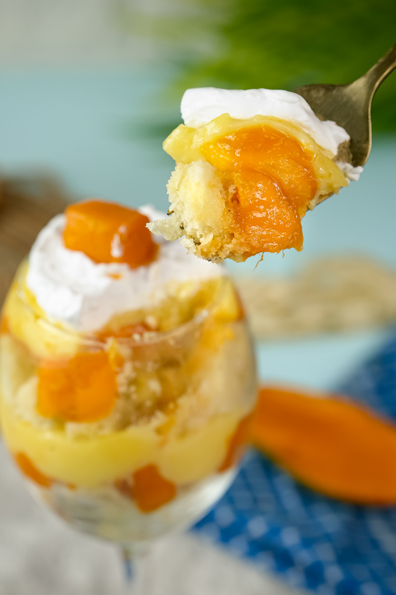 Perfect bite showing mango trifle custard and cake layers