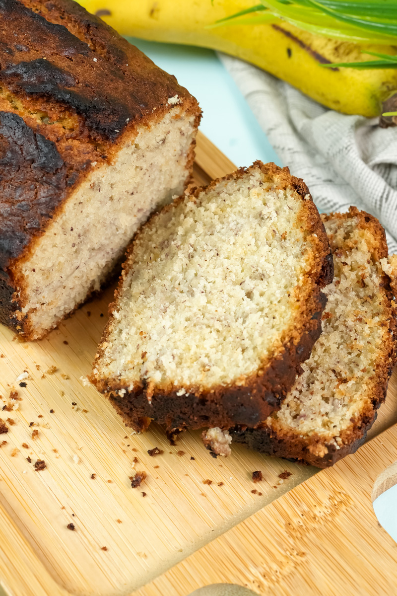 A close-up on a slice of Hawaiian banana bread, highlighting its moist crumb