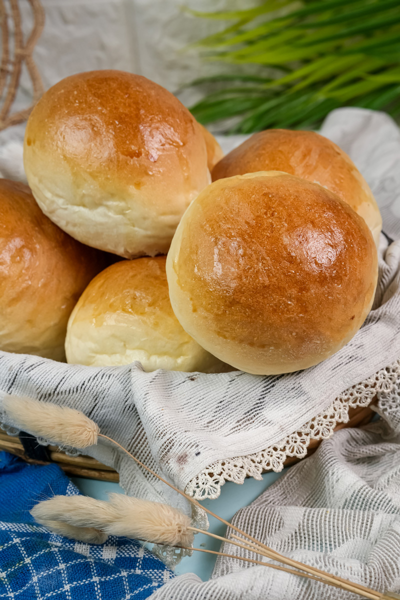 Close-up of soft, golden brown bread bowls ready to be served.