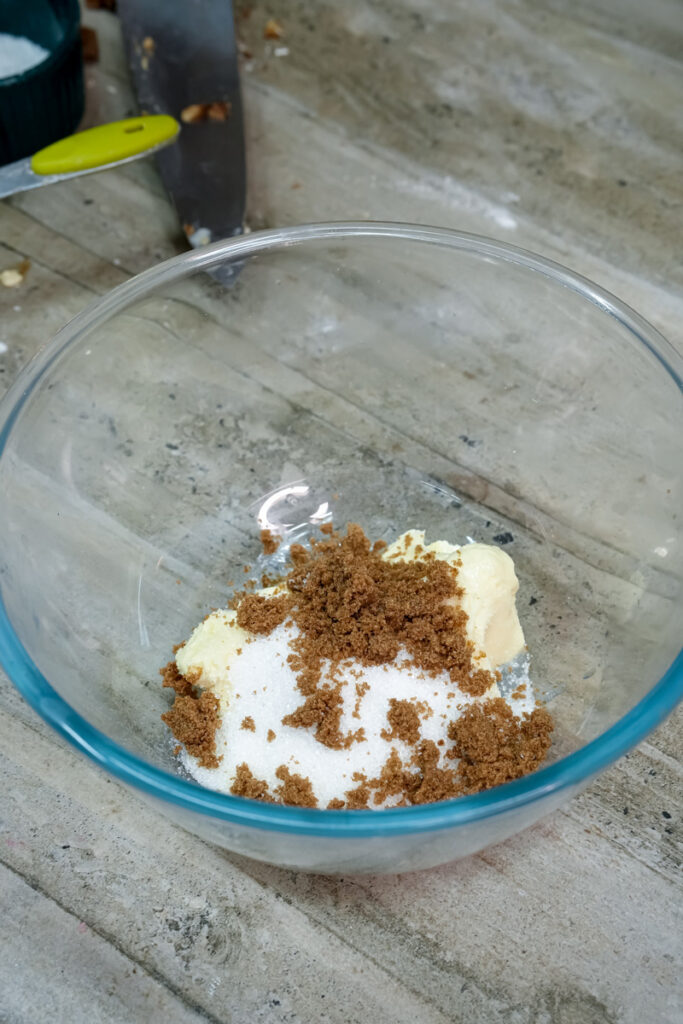 Adding brown sugar and spices to creamed butter mixture