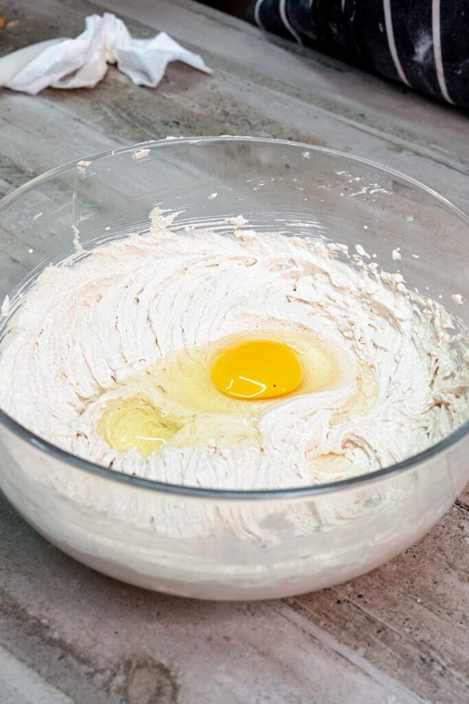 Adding egg to s'mores cookie dough mixture