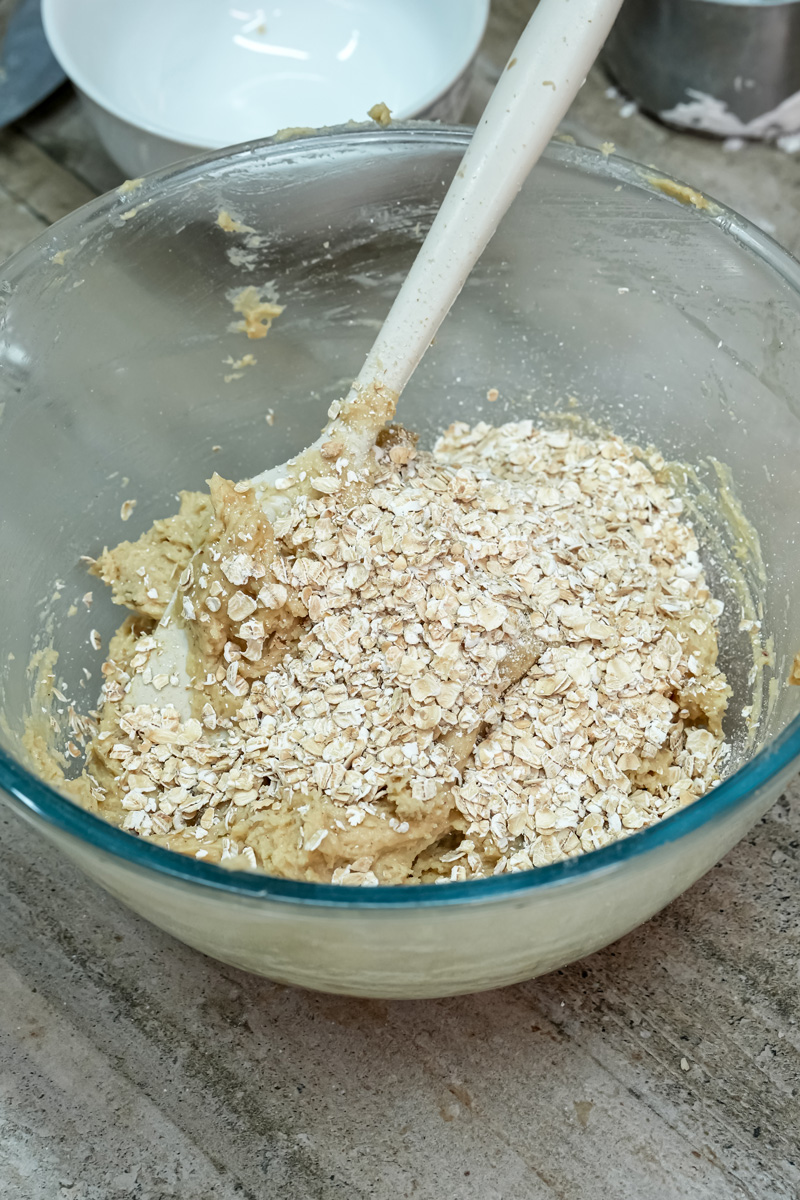 Adding rolled oats to cookie dough mixture