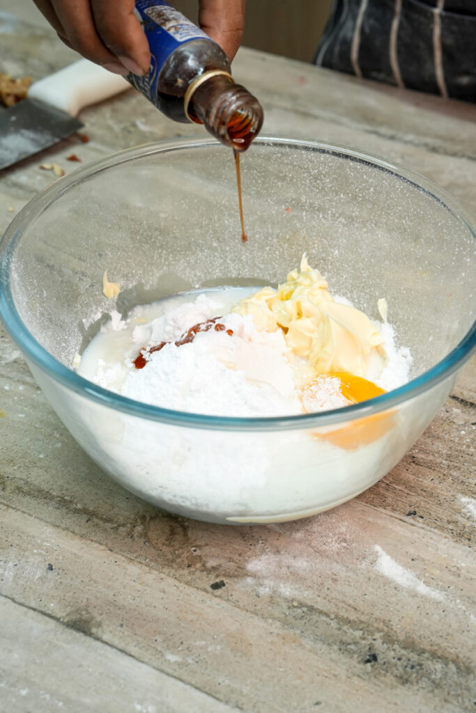 Adding vanilla extract to pineapple bun dough mixture