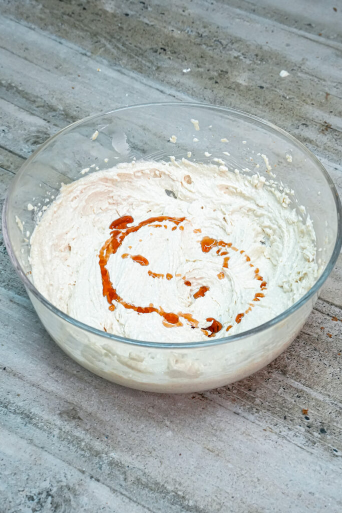 Adding vanilla extract to creamed butter mixture