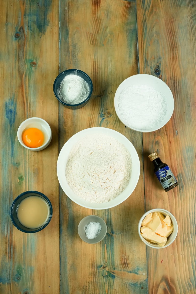 Alfajores cookie ingredients including flour, butter, egg yolk and vanilla