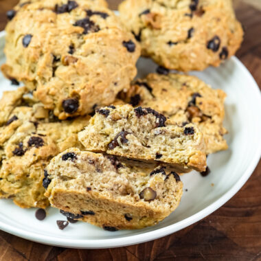 Baked cowboy cookies on white plate showing texture with chocolate chips and oats