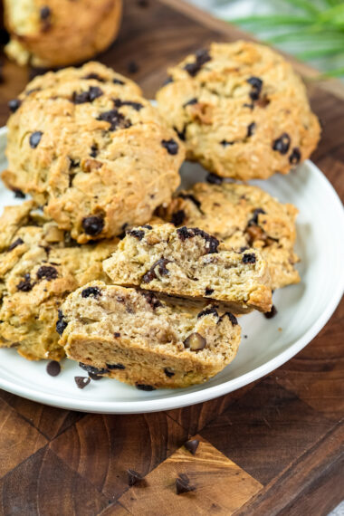 Baked cowboy cookies on white plate showing texture with chocolate chips and oats