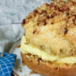 Close-up of bee sting cake showing texture of honey almond topping and pastry cream
