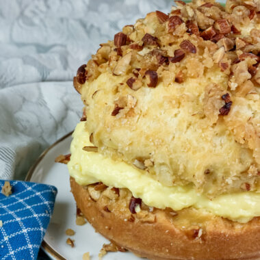 Close-up of bee sting cake showing texture of honey almond topping and pastry cream