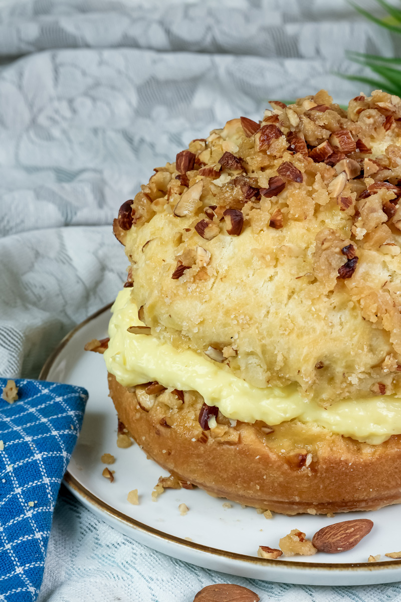 Close-up of bee sting cake showing texture of honey almond topping and pastry cream
