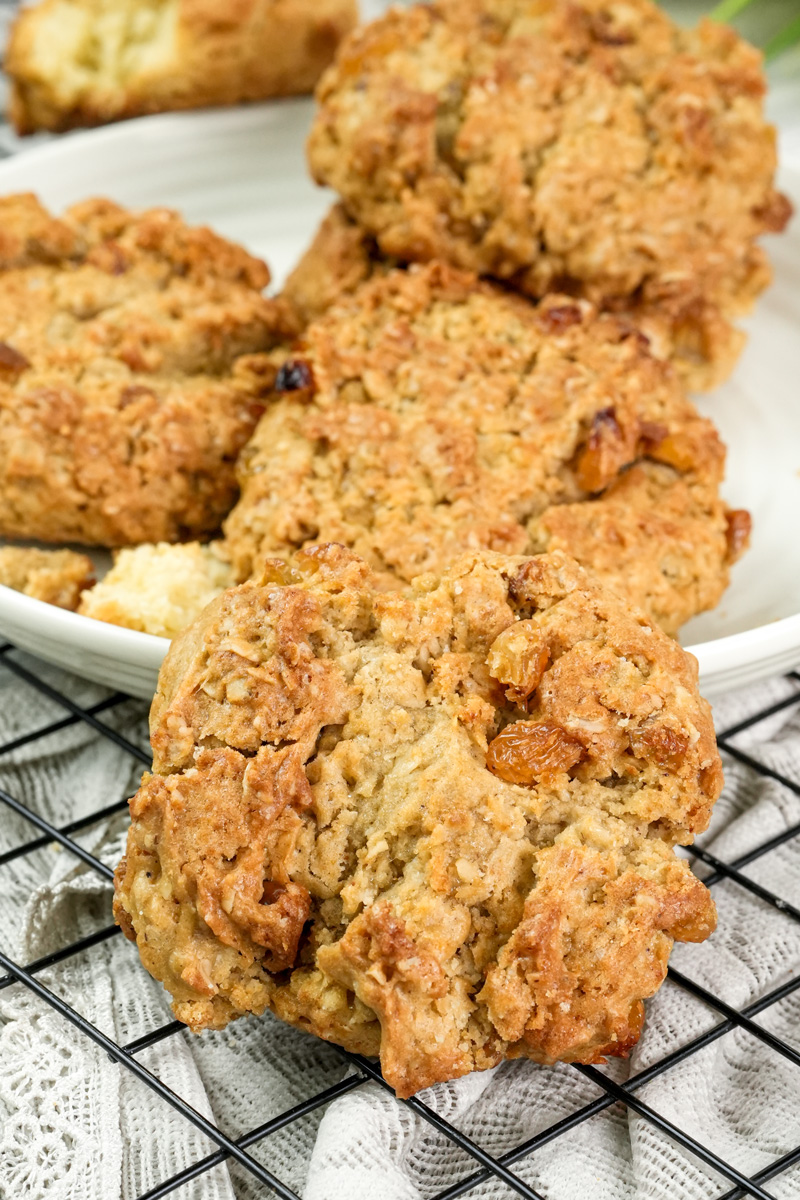 Broken oatmeal raisin cookie showing chewy texture and raisins