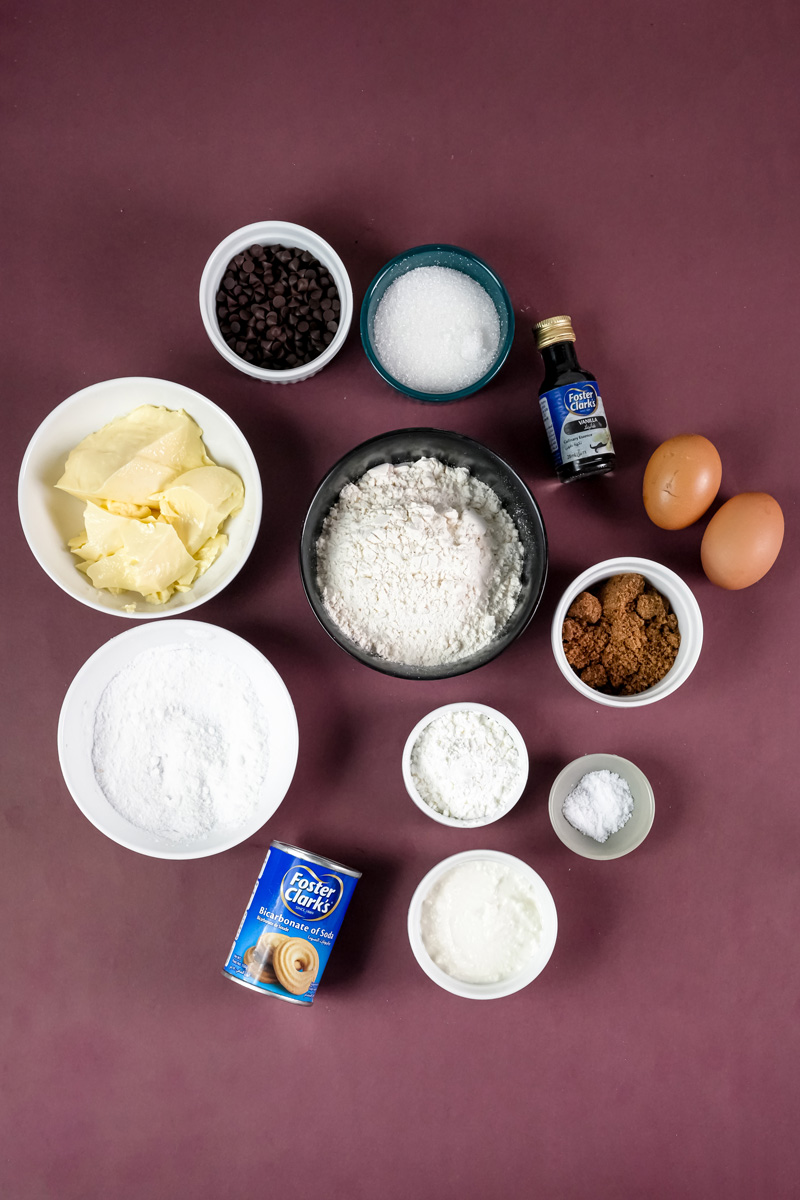 Cheesecake cookie ingredients layout with chocolate chips and flour