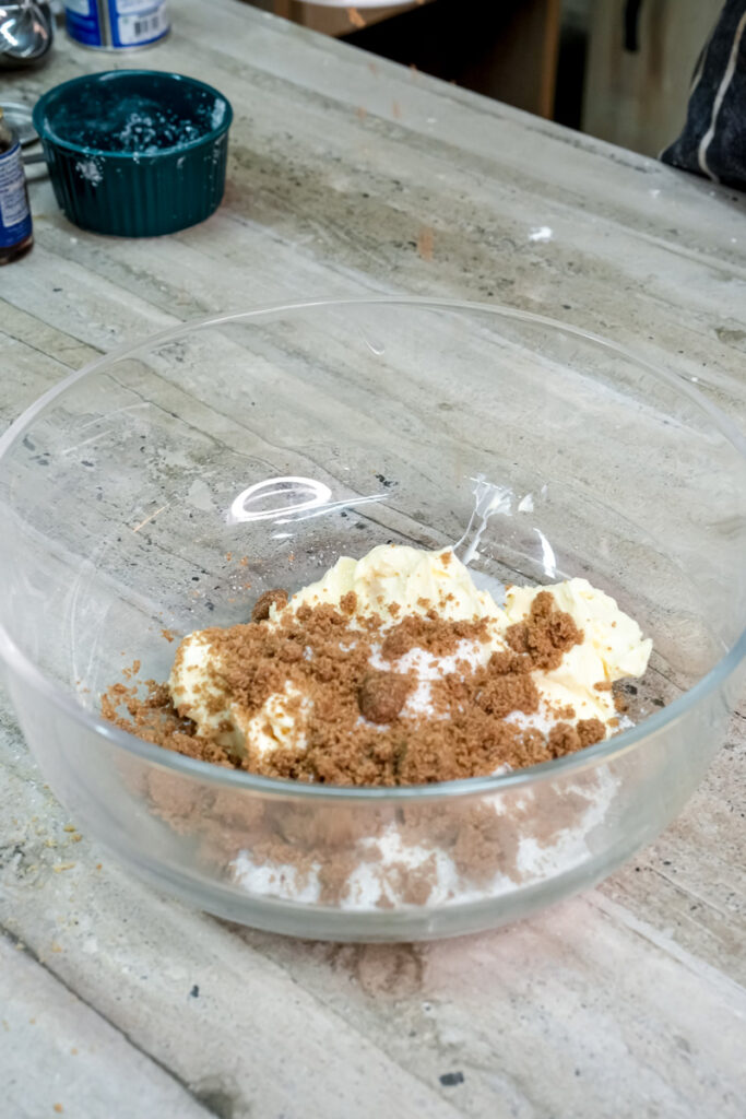 Combining dry ingredients for s'mores cookies in glass bowl
