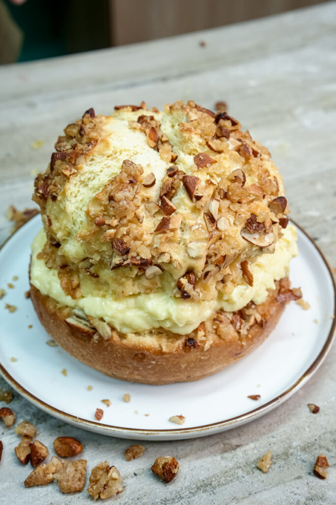 Complete bee sting cake with thick pastry cream and caramelized almond topping