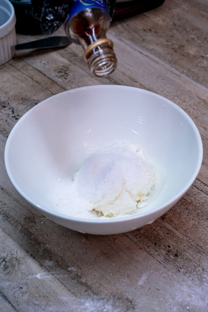 Cottage cheese in white bowl for cheesecake cookies