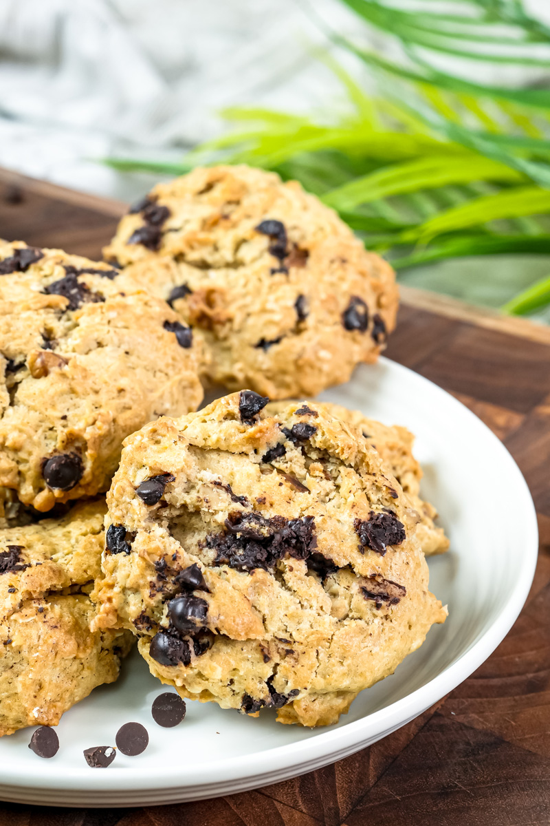 Cowboy cookies on plate with bite taken showing soft interior texture