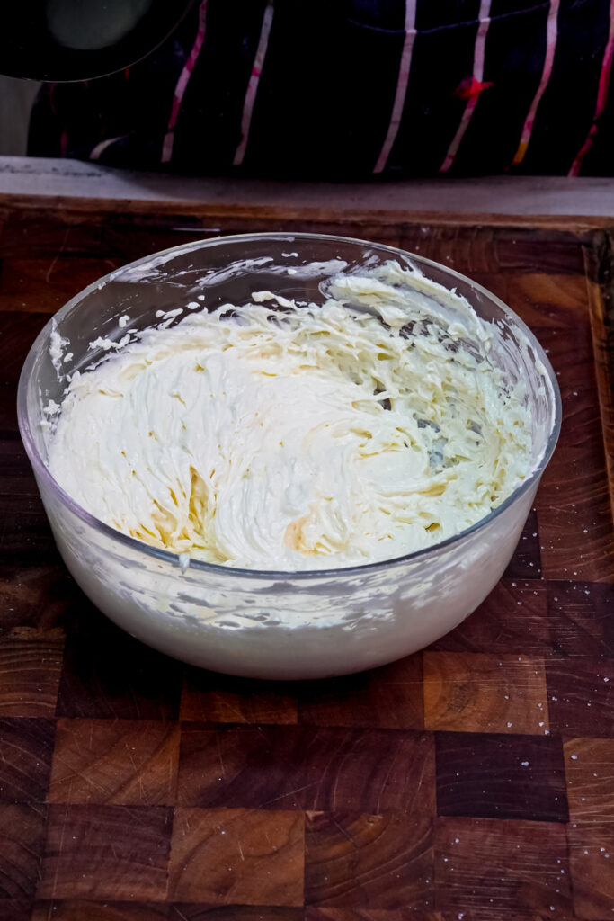 Creamy, well-mixed cookie dough base in a glass bowl