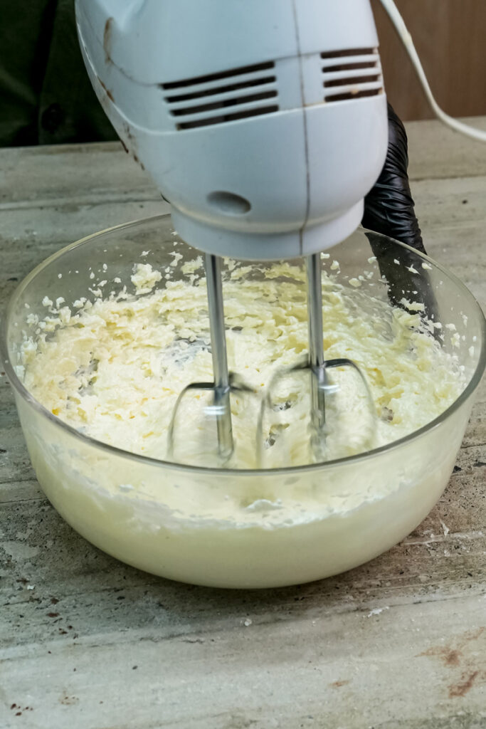 Electric mixer beating Twix cookie dough ingredients
