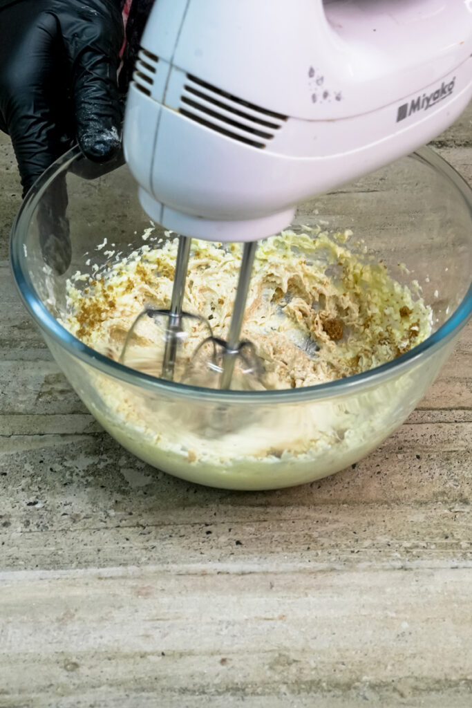 Electric mixer creaming butter and sugars together