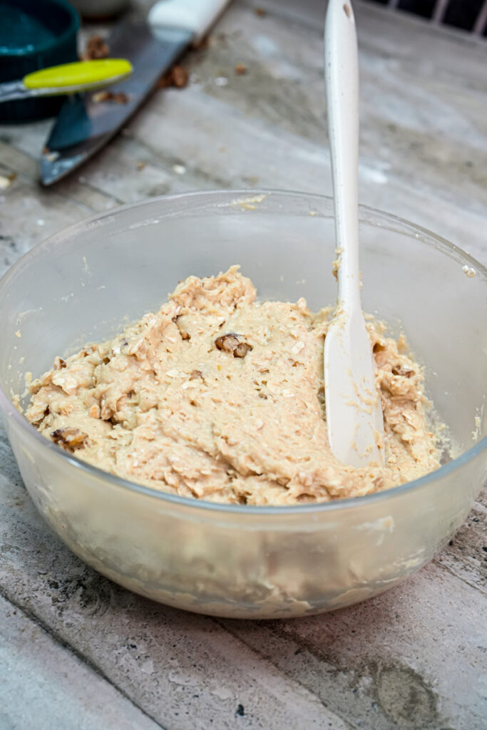 Final cowboy cookie dough with oats, nuts and chocolate chips mixed in