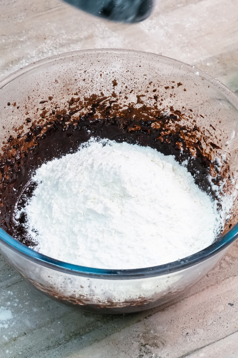 Flour and baking powder added to the wet ingredients.