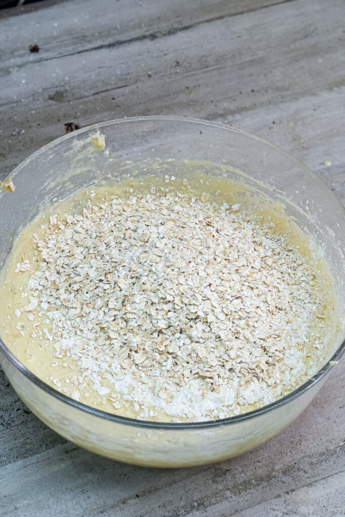 Folding oats into ranger cookie dough mixture