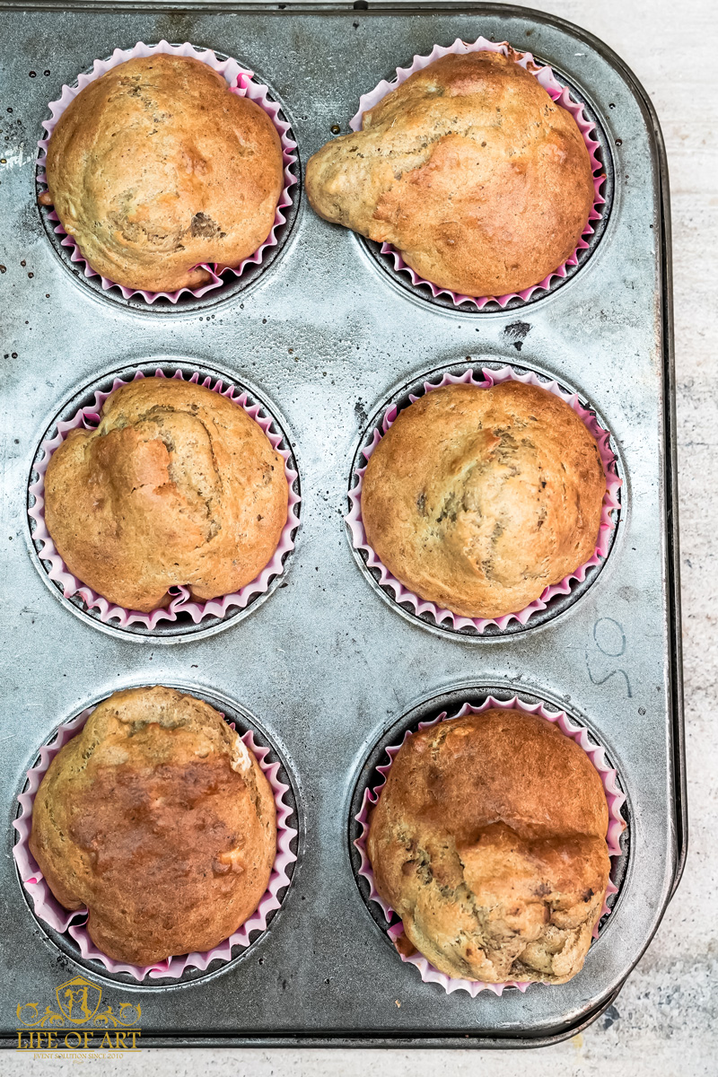 Freshly baked banana muffins in a muffin tin