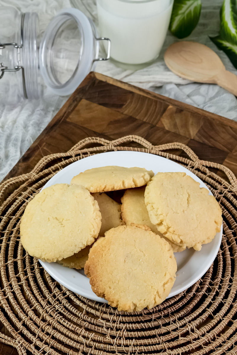 Freshly baked milk cookies on white plate