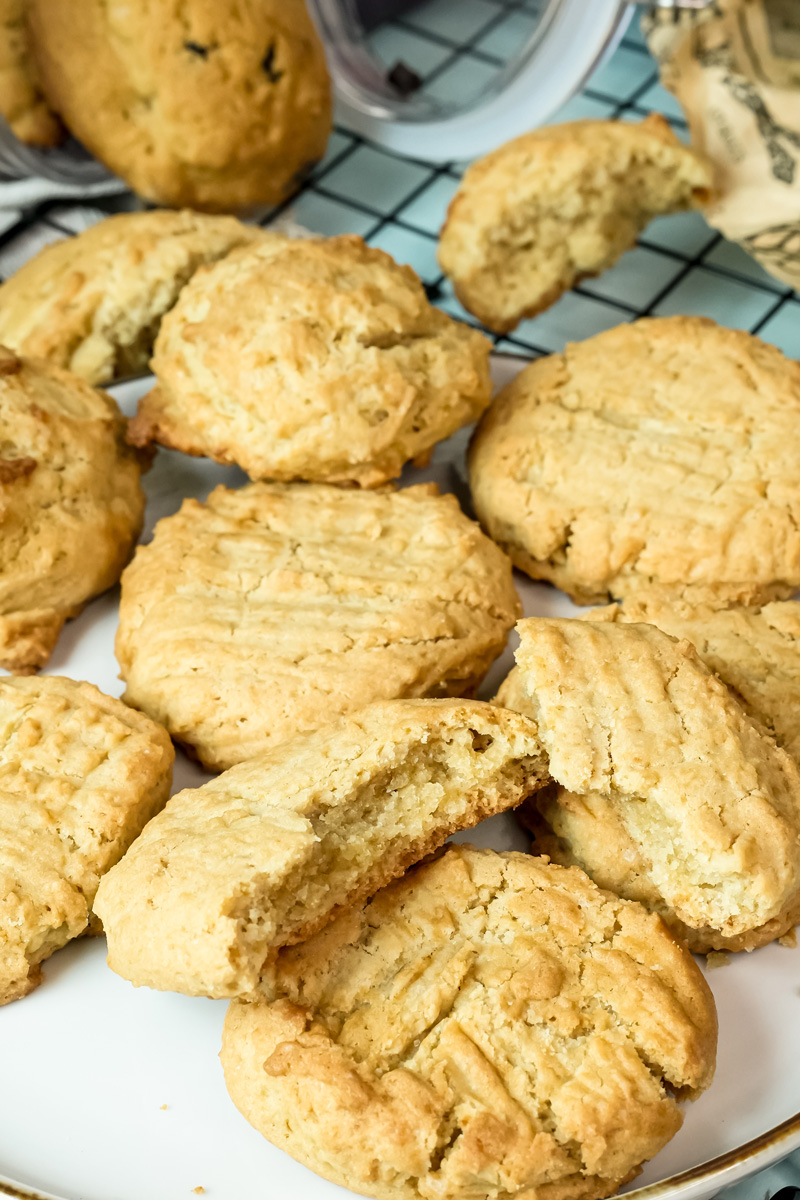 Freshly baked peanut butter cookie broken in half to show the inside