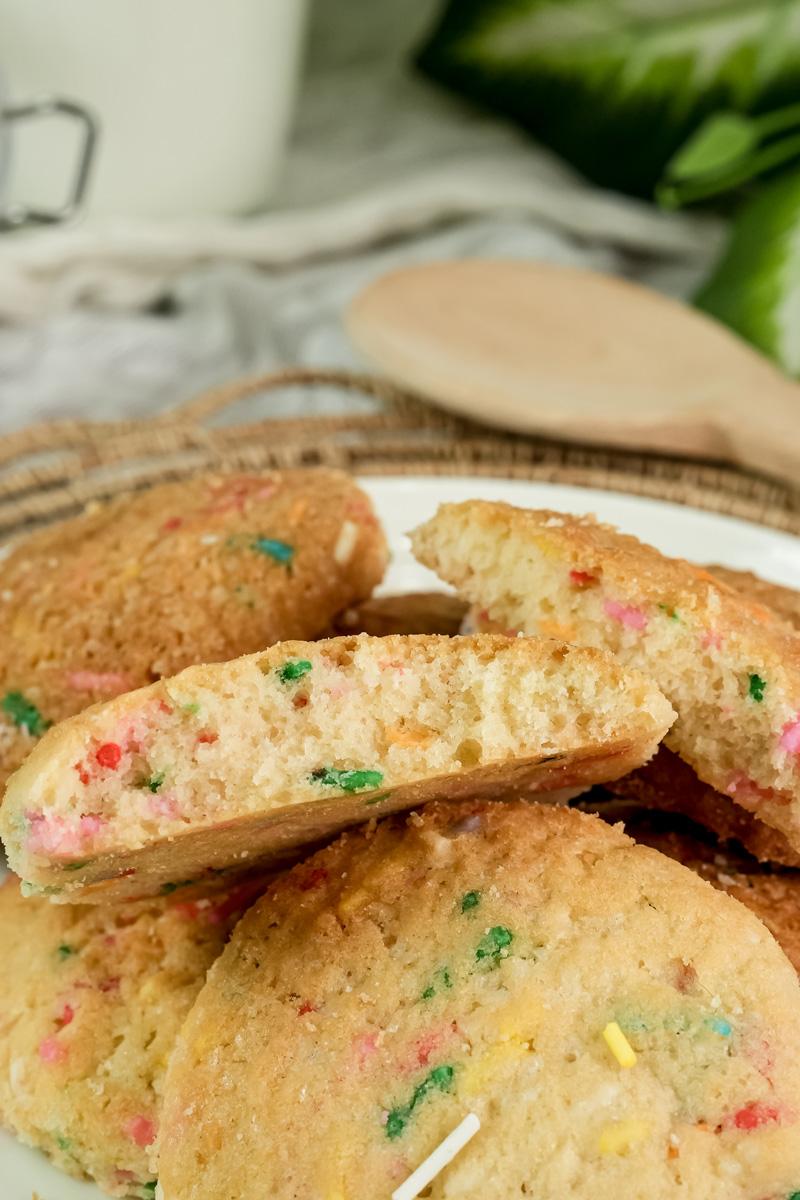 A close-up of the inside of a Funfetti cookie, showing the colorful sprinkles