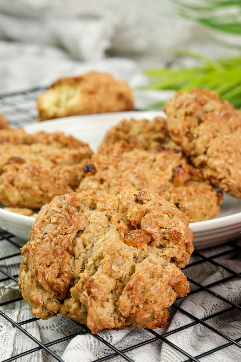 Golden baked oatmeal raisin cookies cooling on wire rack