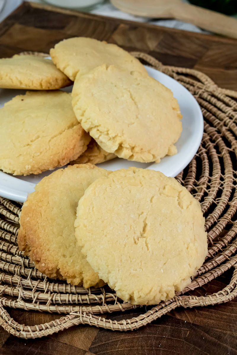 Golden brown milk cookies on woven basket