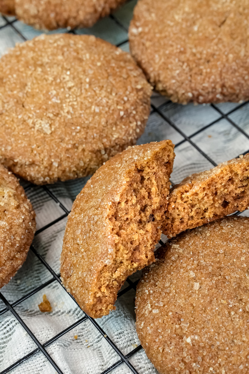 Golden brown molasses cookies with cracked sugar-coated surface