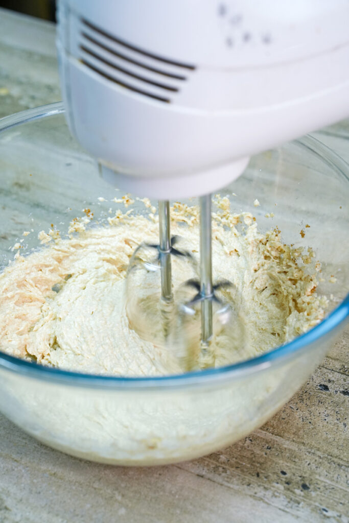 Hand mixer creaming butter and sugar together
