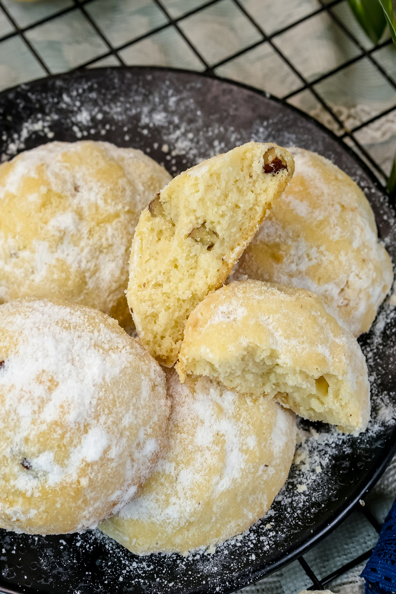 Homemade Mexican wedding cookies showing crumbly texture and walnut pieces