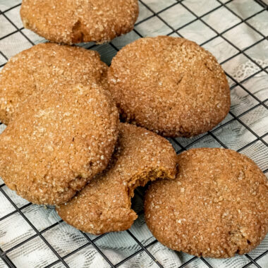 Freshly baked molasses cookies cooling on wire rack