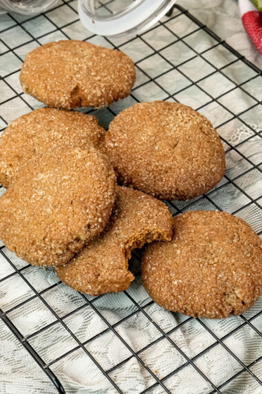 Freshly baked molasses cookies cooling on wire rack