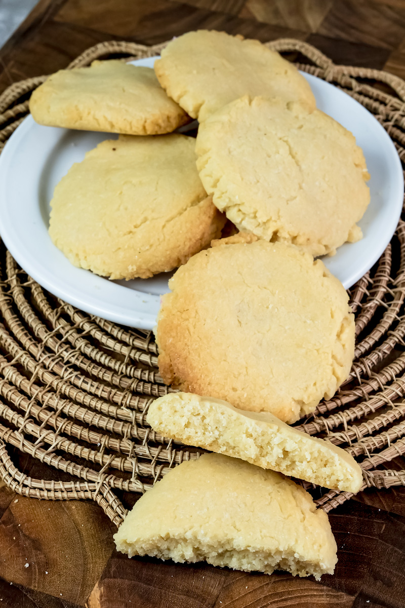 Milk cookies with crumbly texture on wicker tray