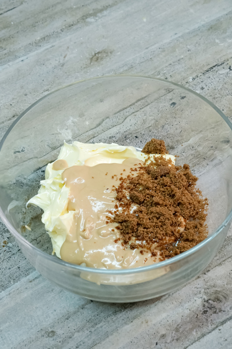 Mixing butter, peanut butter, and sugar for cookies
