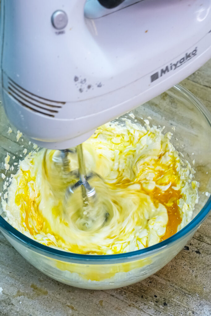 Mixing cheesecake cookie batter with electric mixer