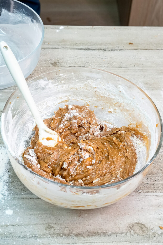 Mixing molasses cookie dough with rubber spatula