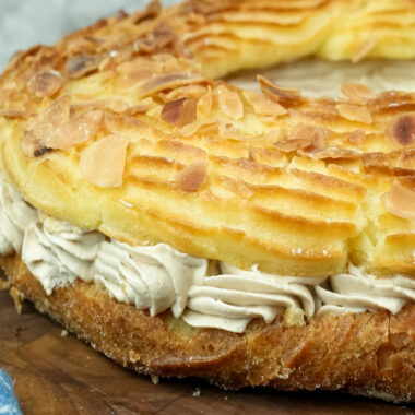 Close-up Paris Brest texture with almonds and golden crust