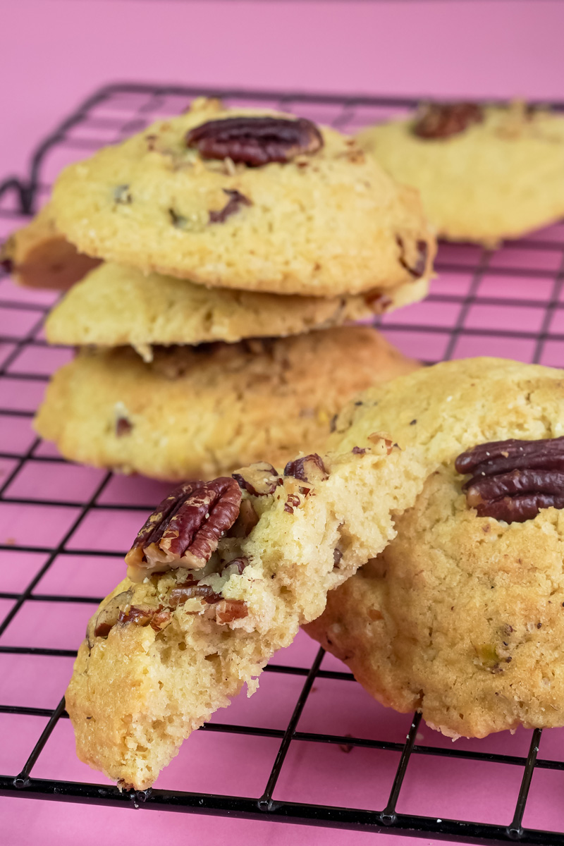 Close-up of a Pecan Pie cookie broken in half, showing the texture