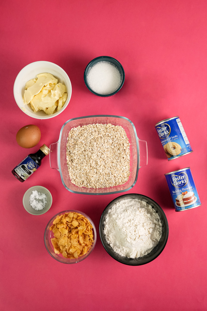 Ranger cookie ingredients laid out including oats, flour, butter, and baking supplies